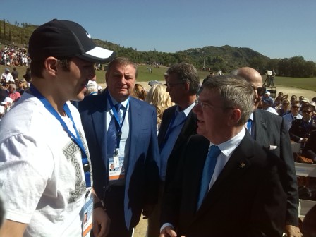 IOC President Thomas Bach meeting Russias first torchbearer Alex Ovechkin during the Olympic Flame Lighting Ceremony