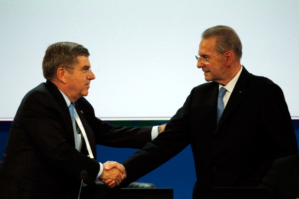 Jacques Rogge congratulating his successor Thomas Bach in one his final acts as President of the IOC