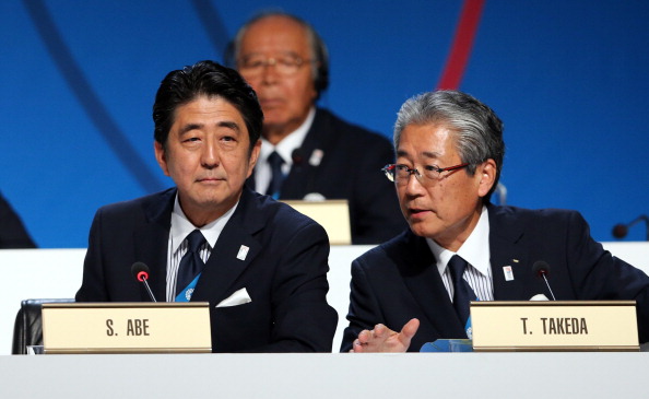 Japan's Prime Minister Shinzo Abe and President of the Tokyo 2020 Committee Tsunekazu Takeda speak during the Tokyo 2020 bid presentation