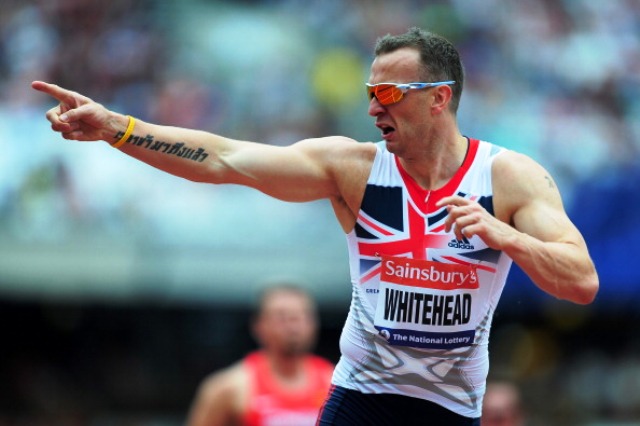 Paralympic champion Richard Whitehead crosses the line first at the Sainsburys Anniversary Games