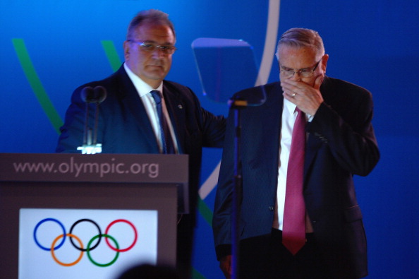 Riccardo Fraccari comforts Don Porter, his co-President of the World Baseball Softball Confederation, following an emotional pitch to the IOC to try to get the sports back on the Olympic programme