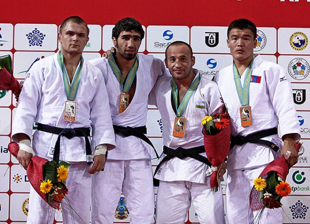 Russian Khasan Khalmurzaev (second from left) took the first men's title of the day in the -81kg category