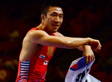 Ryu Han-Su celebrates one of two gold medals for South Korea on the final day of the wrestling world championships in Budapest