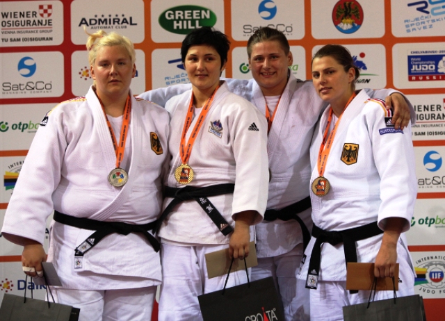Slovenias Lucija Polavder (second from left) celebrates with her gold medal and female athlete of the tournament award