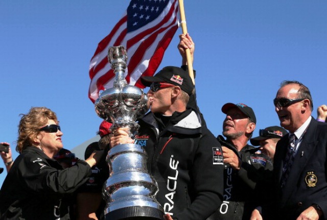 Team Oracle USA skipper James Spithill lifts the America's Cup for the second time in succession following victory over Team New Zealand