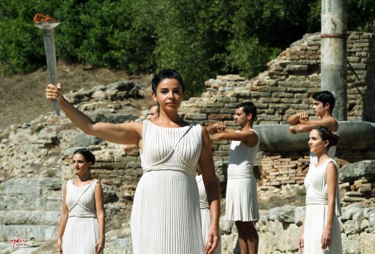 The Olympic flame begins its journey, in the arm of the High Priestess Ino Menegaki, from the Temple of Hera to the Ancient Olympic Stadium