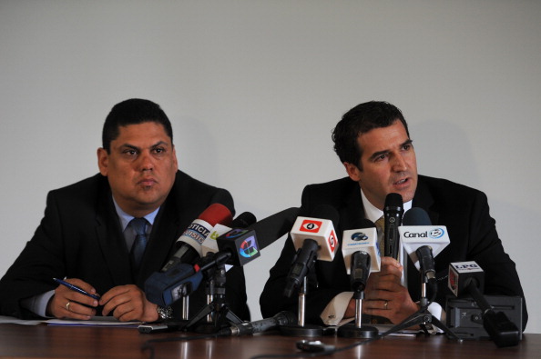 The President of El Salvadors Football Federation Carlos Mendez Flores alongside the secretary-general of CONCACAF Enrique Sanz