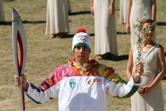 The first torchbearer Yiannis Antoniou upon recieving the Torch from the High Priestess