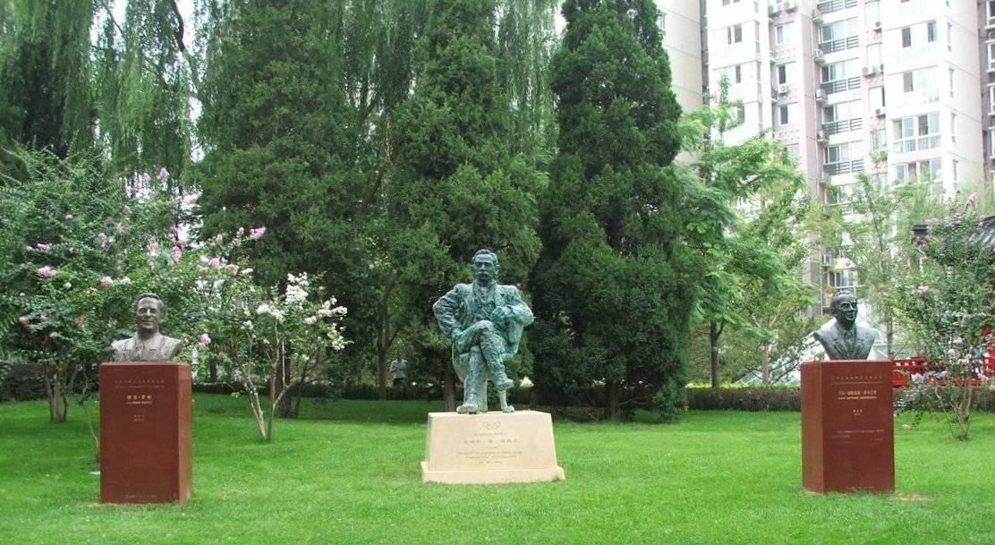 The statues of Jacques Rogge, Pierre de Coubertin and Juan Antonio Samaranch at a public park in Beijing