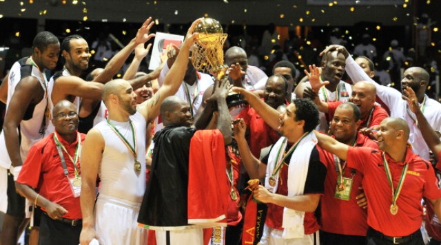 The victorious Angolan squad celebrate their 11th African title in Abidjan