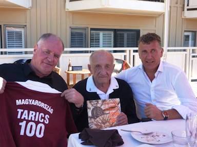 The worlds oldest Olympic champion Sandor Tarics centre receives his special gifts from Dr Denes Kemeny President of the HWPF left and general secretary of the HOC Bence Szabo