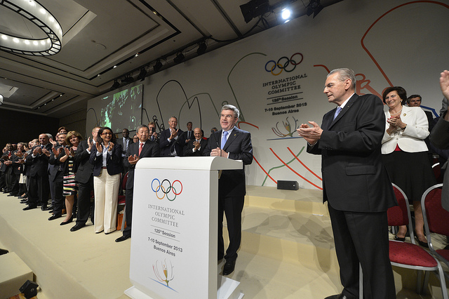 Thomas Bach being congratulated by IOC members following his popular victory