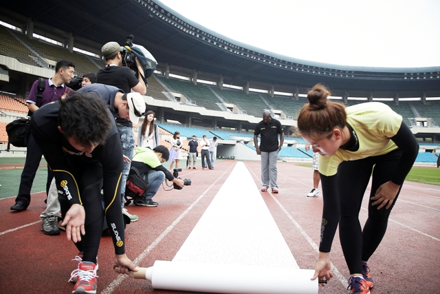 Ben Johnson, on his visit to the Jamsil Olympic Stadium in Seoul, studies the 1,000 people that have signed the anti-doping petition organised by sportswear company SKINS that will be presented to the International Olympic Committee and World Anti-Doping Agency  