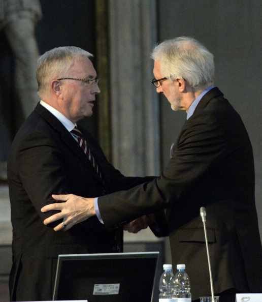 Brian Cookson is congratulated by Pat McQuaid after being elected to replace the Irishman as President of the International Cycling Union