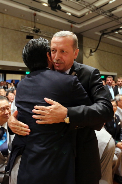 Japan's Prime Minister Shinzo Abe embraces Turkey's Prime Minister Recep Tayyip Erdoğan after Tokyo were awarded the 2020 Olympics and Paralympics