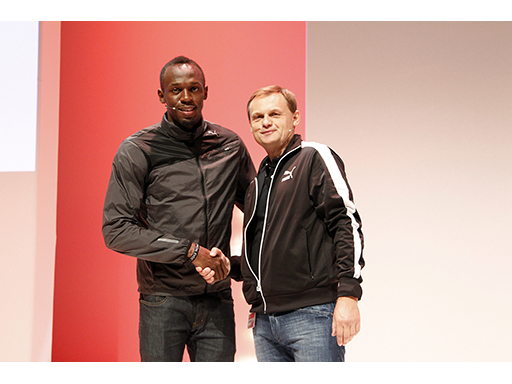 Usain Bolt seals his new Puma deal with the company's chief executive Bjoern Gulden