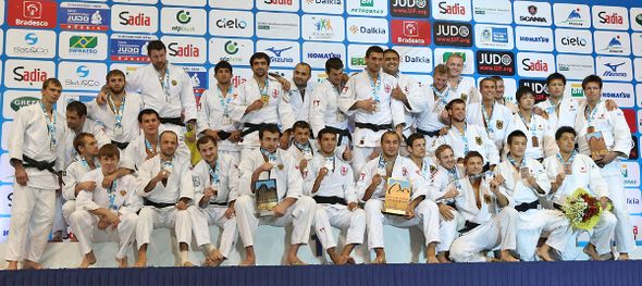The medallists from the men's team event celebrate their success at the World Championships