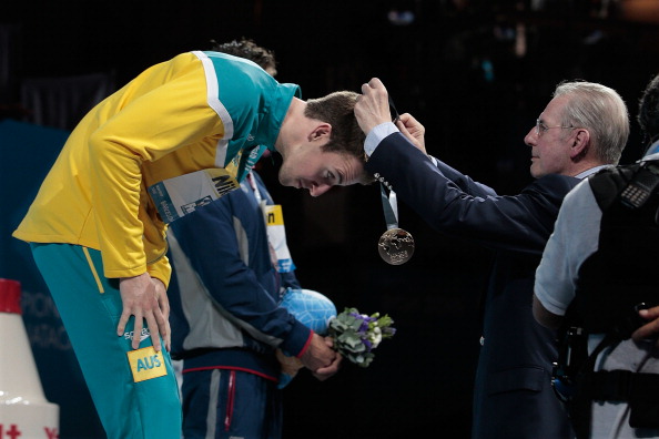 Jacques Rogge, pictured giving James Magnussen of Australia his gold medal after winning this year's world 100m freestyle swimming title, has always made a point of putting athletes centre-stage