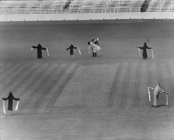 Scarecrows on the pitch at The Oval in 1957 as the groundsman prepares to prepare the ground without the botheration of pigeons