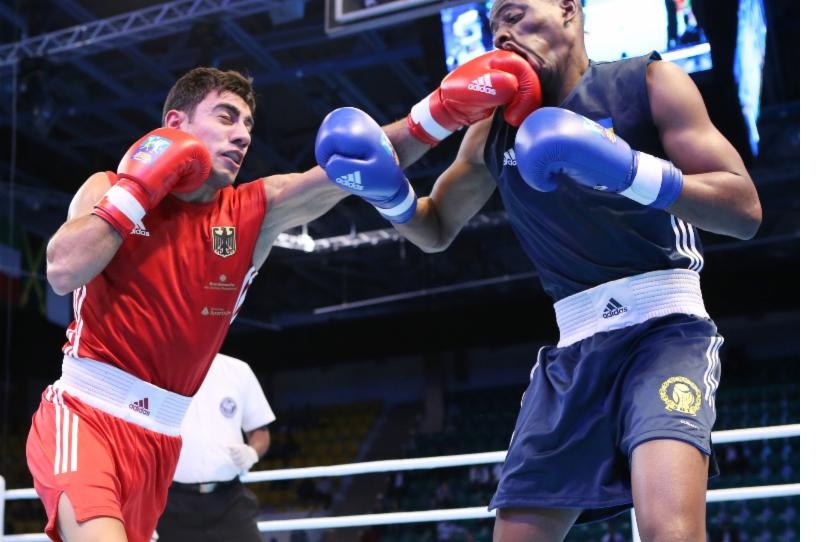 Artem Harutyunyan connects a punch against Swedens Clarence Bojang