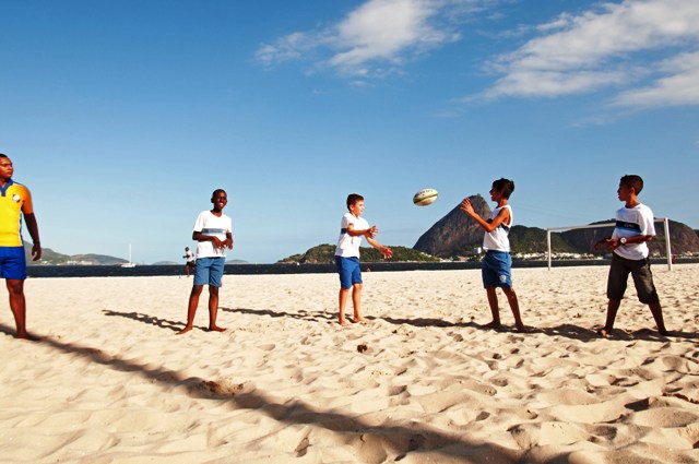 Brazilians are used to playing football on the beaches of Rio but these youngsters have swapped the round ball for the oval ball