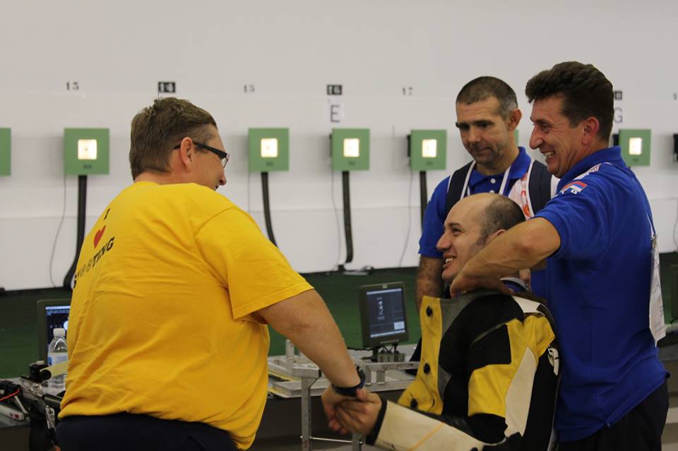 Dragan Ristic of Serbia is congratulated after his thrilling gold medal in the R5 event