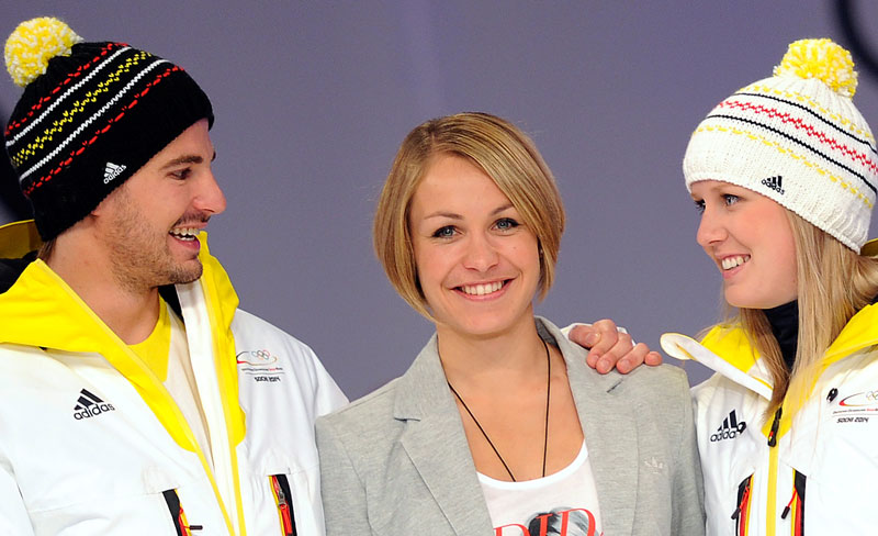 Double Olympic gold medallist biathlete Magdalena Neuner (centre) has designed the official beanie hat that German athletes will wear at Sochi 2014