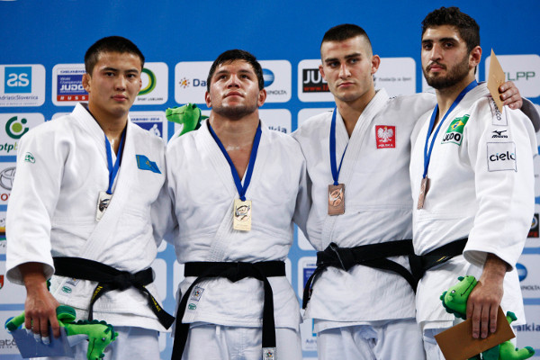 Georgian fighter Beka Gviniashvili stands atop the podium after adding the Junior World under 90kg title to a string of earlier honours