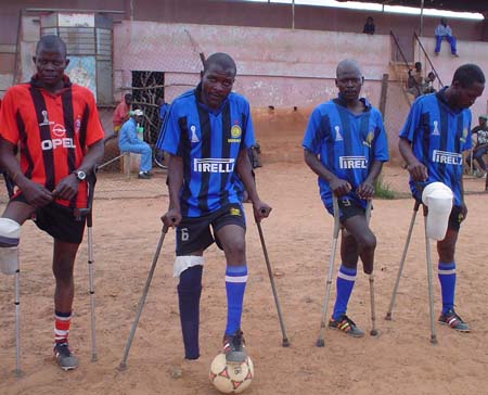 Getting disabled people into sport such as these Angolan footballers is a major aim for the Paralympic movement