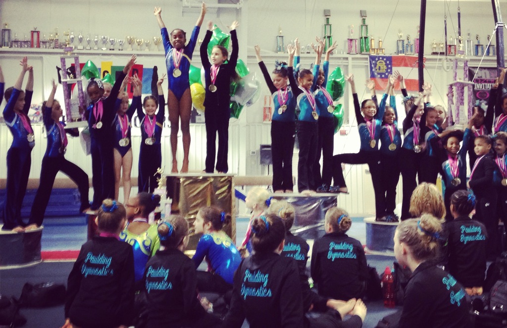 Hundreds of medals were doled out like candy at my nine-year-old daughter's gymnastics competition recently