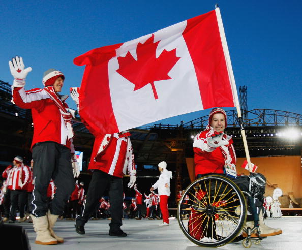 Ice Sledge Hockey star Todd Nicholson, pictured carrying  the Canadian flag at Turin in 2006 before he helped the team win the gold medal, will be another speaker