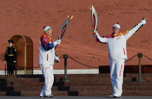 Georgia is angry that Ivan Nechayev (right), a military pilot from its 2008 war with Russia, was among 10 people chosen to carry the Sochi 2014 Olympic Torch when it arrived in Moscow earlier this month