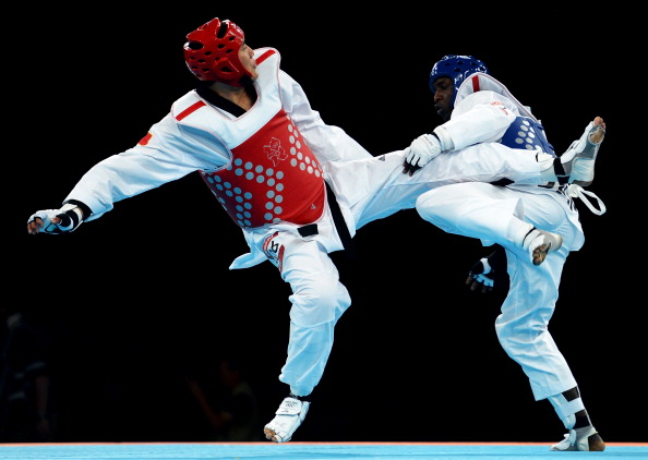 Jamaican taekwondo player Kenneth Edwards in action during the London 2012 Olympics against Xiaobo Liu of China