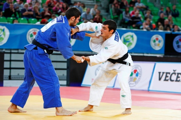 Georgia had to fight from behind to win the men's competition after Gela Kelikhashvili lost the opening bout to Georgios Azoidis