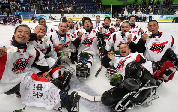 Japan celebrate their surprise silver medal at the 2010 Paralympic Games in Vancouver