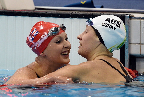 Jessica-Jane Applegate of Great Britain celebrates with silver medallist Taylor Corry of Australia after winning the 200m Freestyle in the S14 category at London 2012