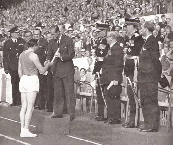 Welsh sprinter Ken Jones hands the Queen's Baton to Prince Philip at the Opening Ceremony of Cardiff 1958
