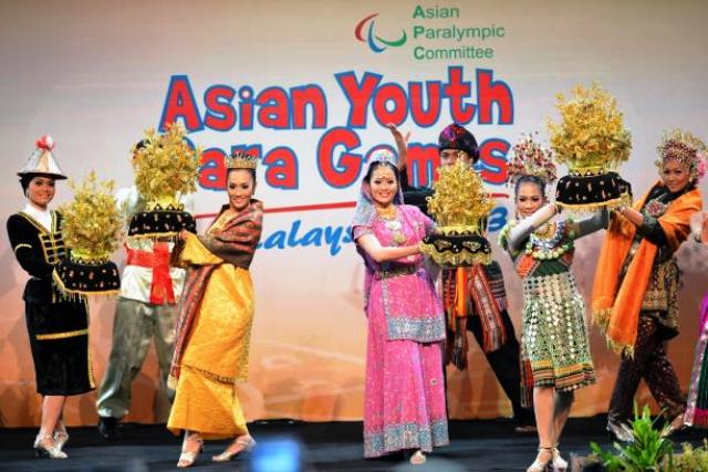 Local dancers from host city Kuala Lumpar perform at the Opening Ceremony of the 2013 Asian Youth Para Games