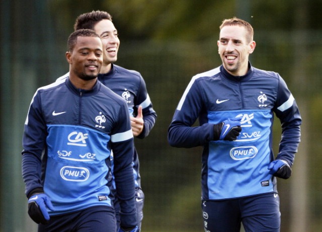 Members of the French squad share a joke ahead of their final Group I World Cup qualifying match against Finland