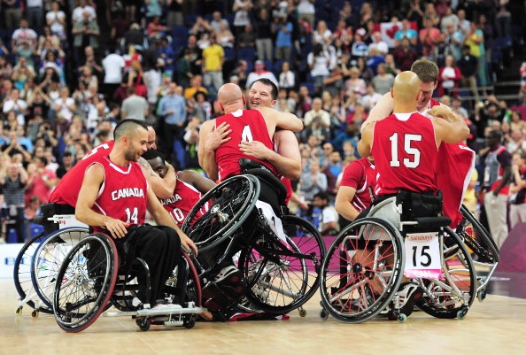 Members of Canada's victorious men's team at London 2012 celebrate after beating Australia in the gold medal match