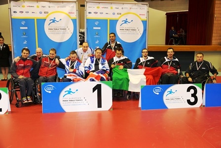 Paul Davies and Rob Davies (centre) celebrate their team gold in Lignano