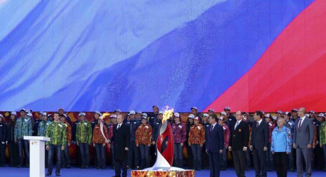 Russian President Vladimir Putin holds a ceremony in the Kremlin in Moscow to begin the Russian leg of the Torch Relay