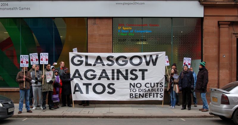 Protests against Atos' sponsorship of next year's Commonwealth Games have been held outside the headquarters of Glasgow 2014