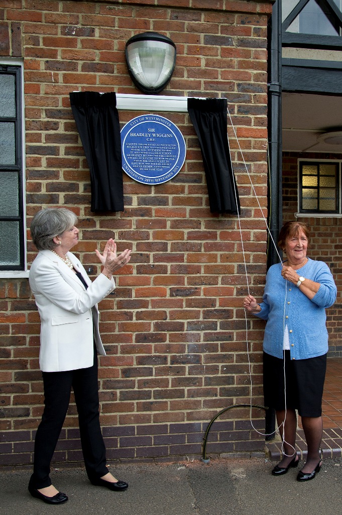 Maureen Cousins (right), grandmother of Sir Bradley Wiggins, unveils a blue plaque Paddington Recreation Ground, where he learned to ride his bike