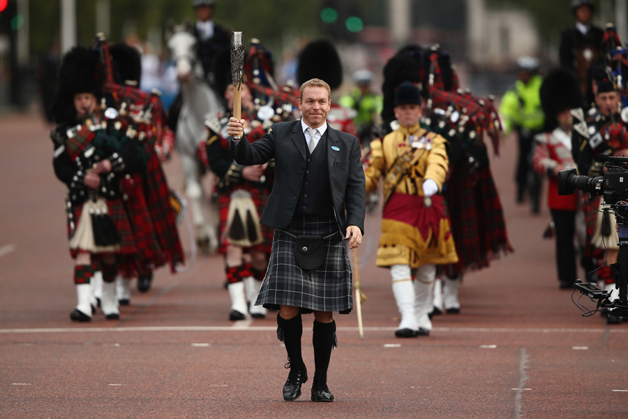 Sir Chris Hoy carries the Baton on the Mall to Buckingham Palace to begin the Ceremony