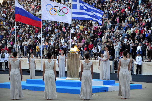 The Greek and Russian flags, along with the one of the International Olympic Committee, fly in the Panathenaic Stadium in Athens as Sochi 2014 prepare to receive the Olympic Torch