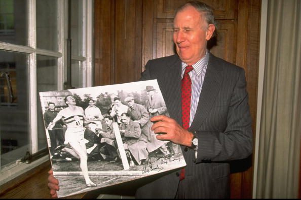 ir Roger Bannister, pictured with a picture of his Four Minute mile achievement in 1954, sagely downplayed the suggestion that Mo Farah was on the brink of another athletics landmark in his first marathon