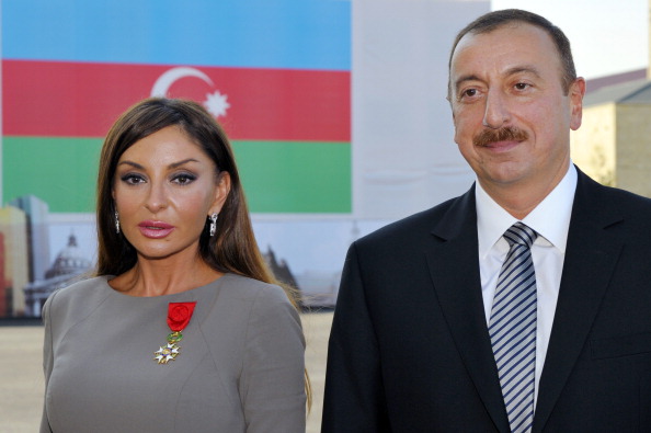 Azerbaijan's President Ilham Aliyev (R) poses beside first lady Mehriban Aliyeva after she was awarded with the Legion d'Honneur medal from the hands of French President Nicolas Sarkozy. © Getty Images