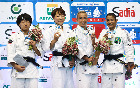 Charline Van Snick, second right, with the bronze medal she won at the World Championships in Rio de Janeiro but which is now in danger after a positive drugs test for cocaine