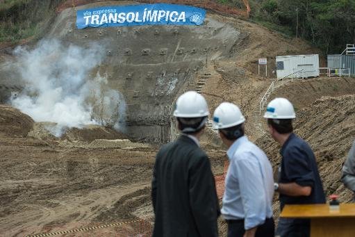 Games dignitaries observe the creation of the new tunnel on the Transolimpica expressway which will link the city centre with other Games sites